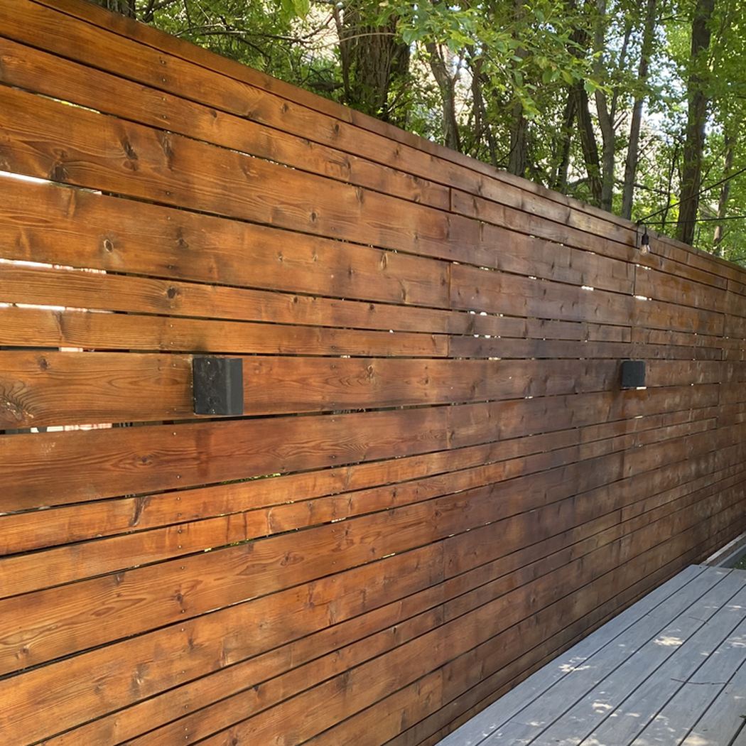 Cedar privacy fence stained a rich warm tone
