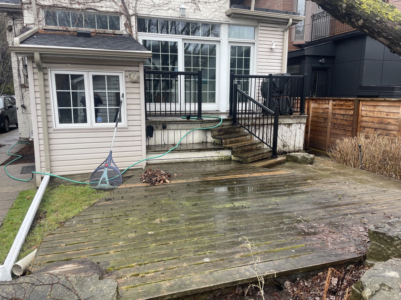 Weathered backyard deck before staining