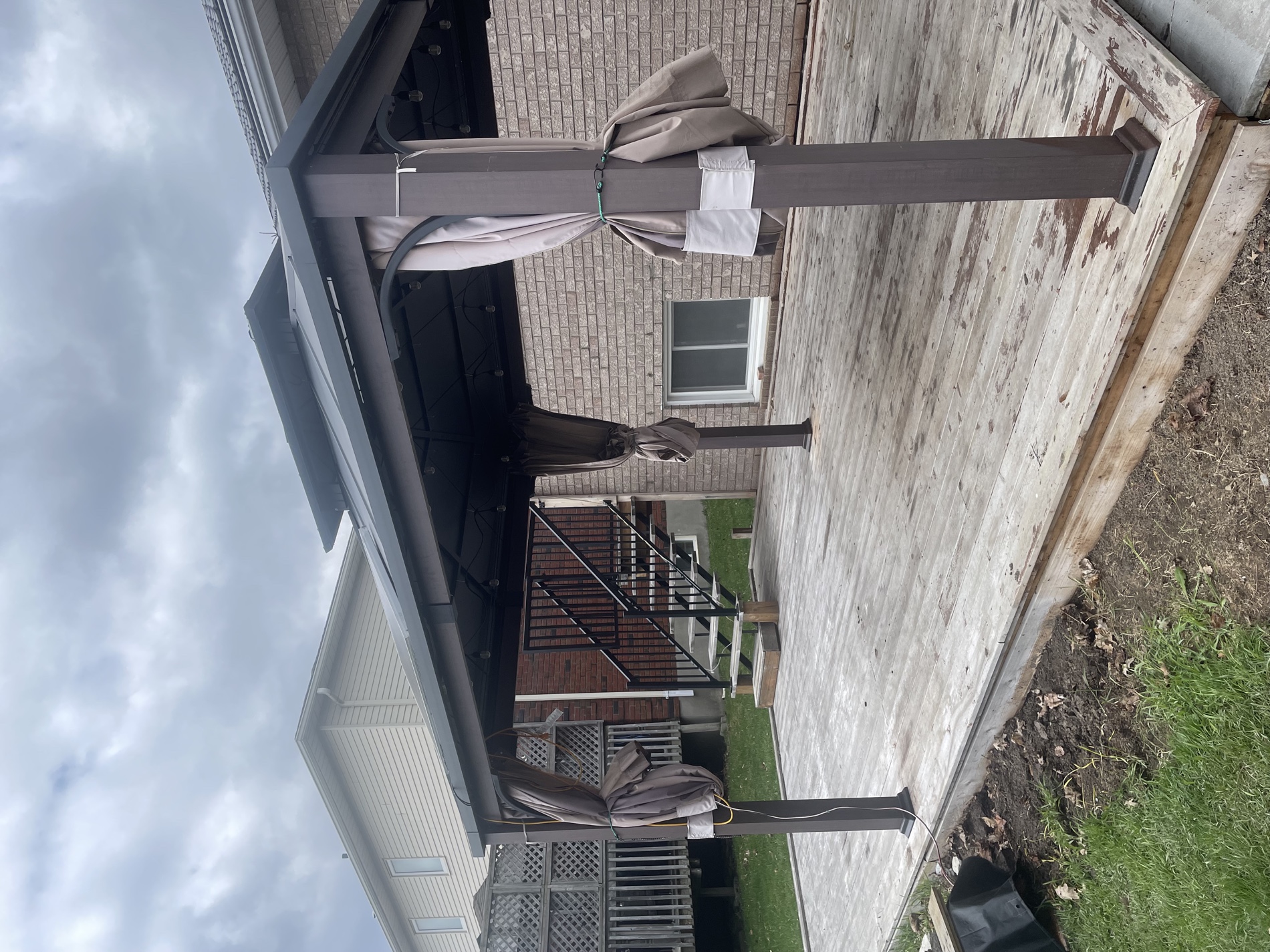 Weathered grey wood deck before staining
