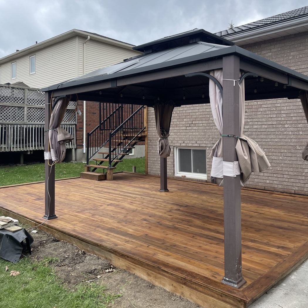 Covered gazebo deck freshly stained a rich tone in Toronto