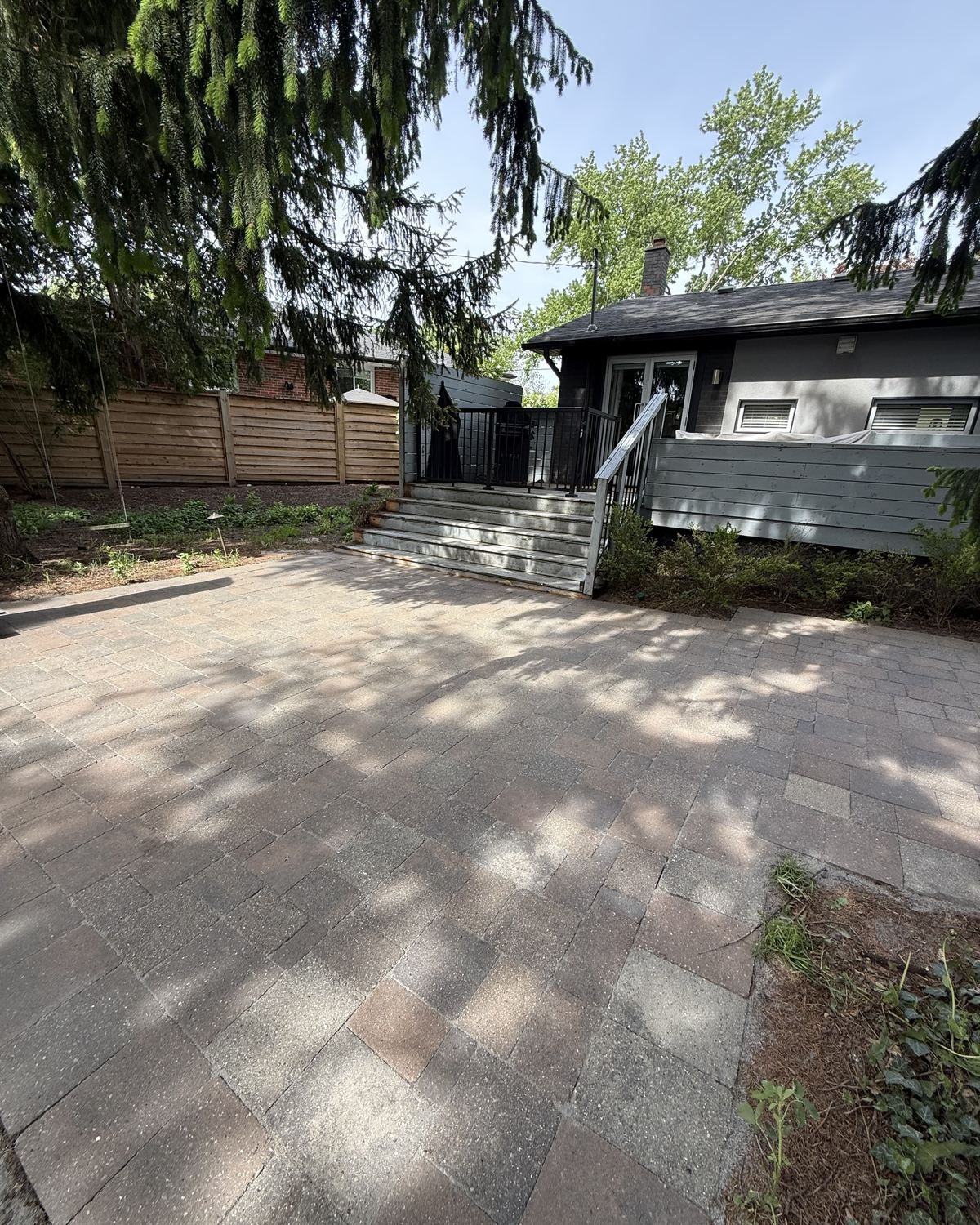 Paver patio and deck steps freshly cleaned in Toronto
