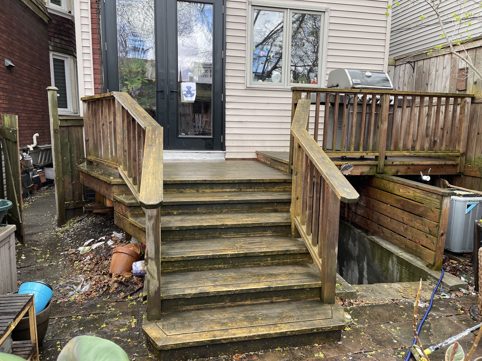 Weathered backyard deck before restoration