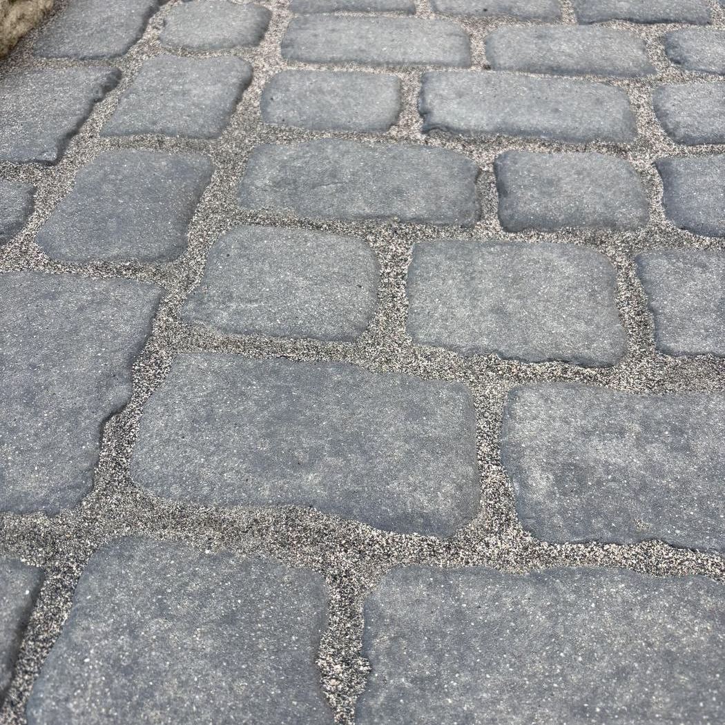 Cobblestone walkway re-sanded with fresh polymeric sand
