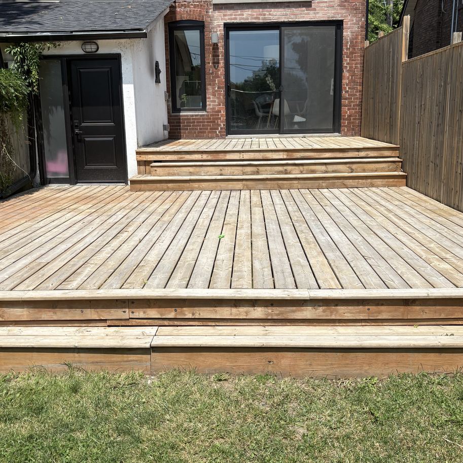 Weathered grey deck and steps before staining