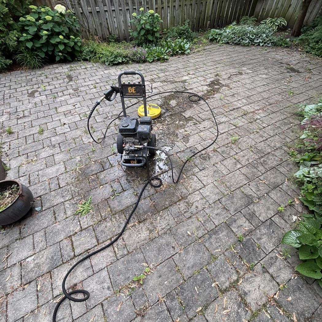 Dirty paver patio before pressure washing